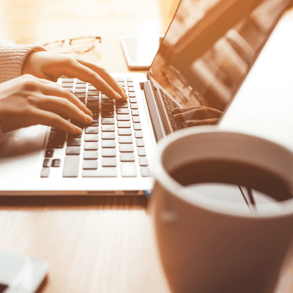 Laptop with a cup of coffee on a table