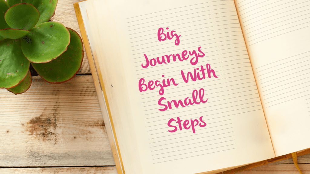 Notebook that says Big Journeys Begin with Small Steps