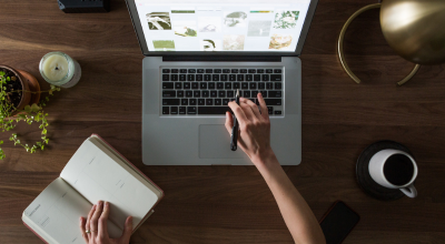 Woman working on laptop on a desk