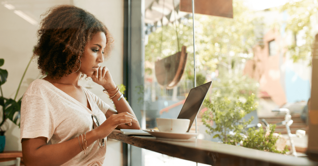 Woman working on Threads content on her laptop