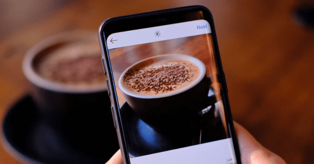 Picture of someone posting a cup of coffee to Instagram