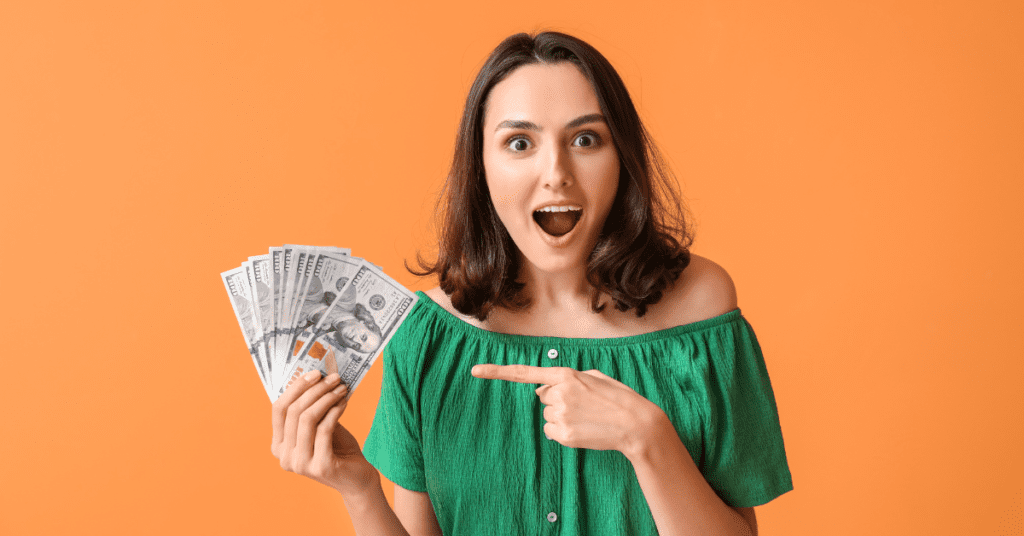 woman holding money representing cost effective ads on Threads